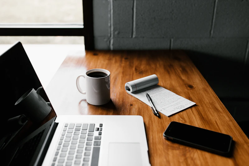 Workspace editorial content marketing notebook and laptop representation